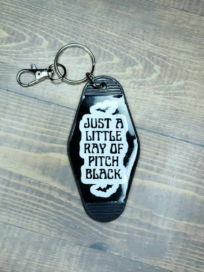 "Just A Little Ray Of Pitch Black" Retro Motel Keychain