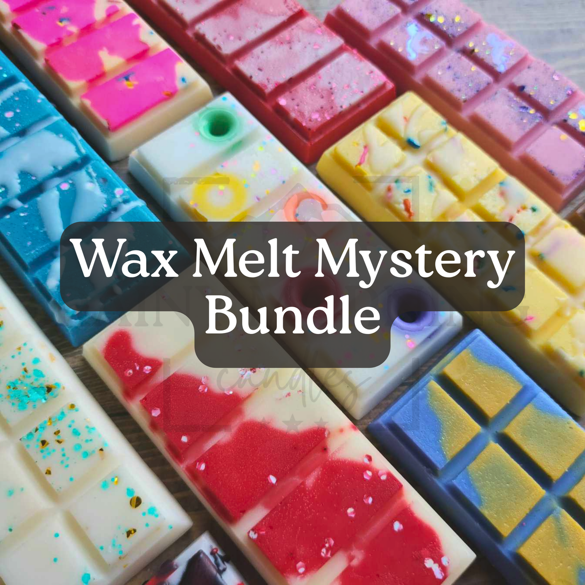 A close-up of multiple colorful wax melts arranged in rectangular bars, with a dark translucent banner across the center reading 'Wax Melt Mystery Bundle.' The wax melts come in pink, red, yellow, blue, white, and multicolor speckled designs.